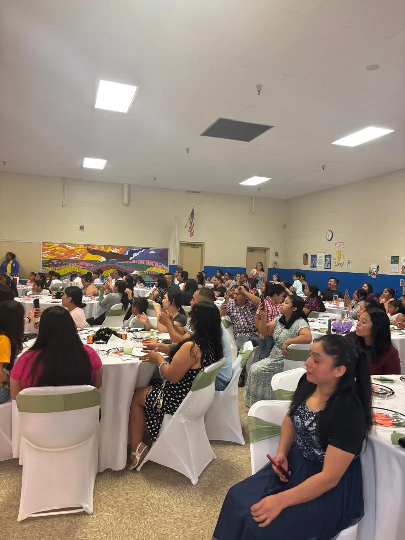 Families and community guests seated during the graduation ceremony