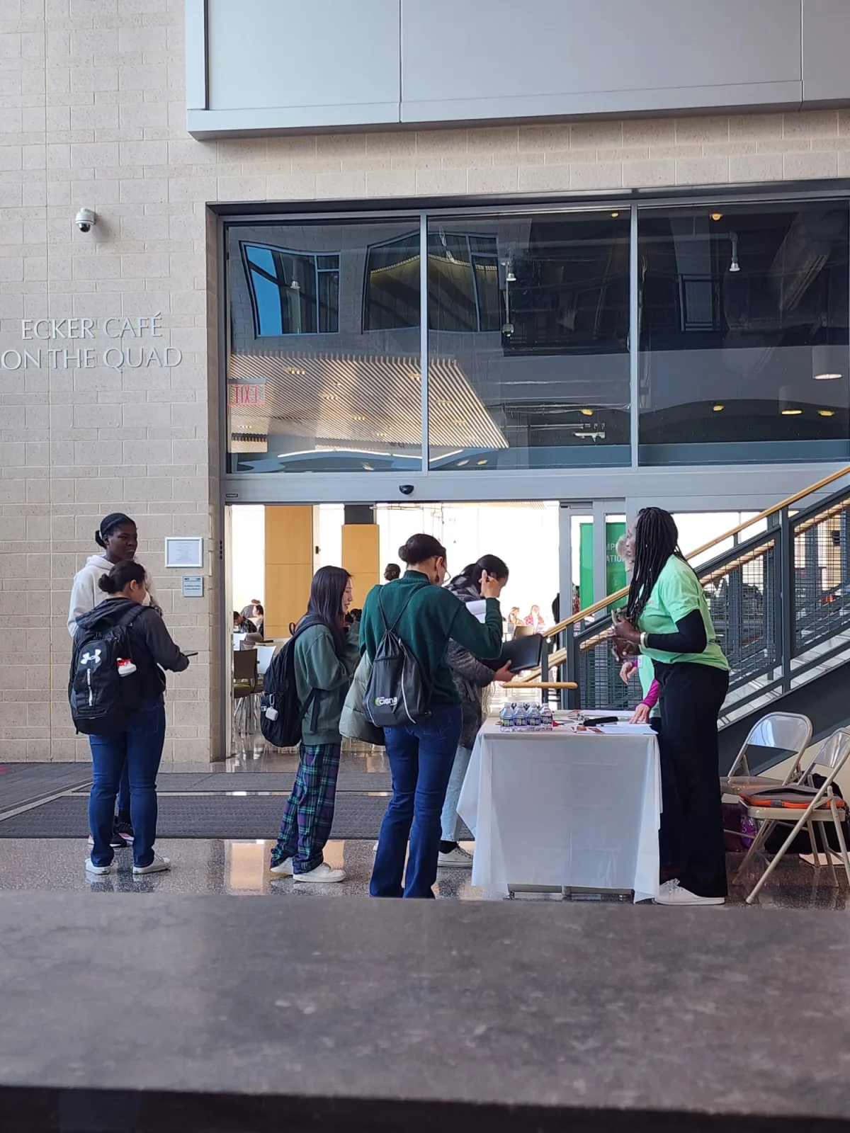 Attendees walking among information tables at the Howard Community College job fair