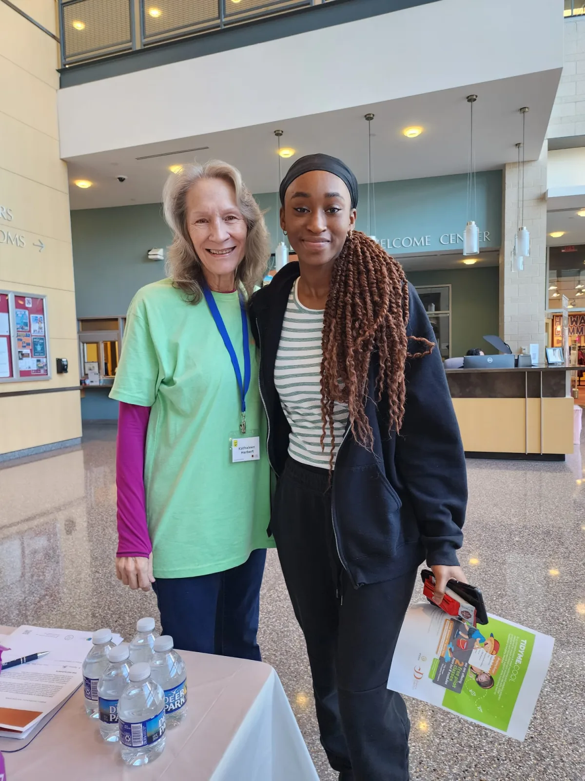 R1YC representatives welcoming visitors at the job fair