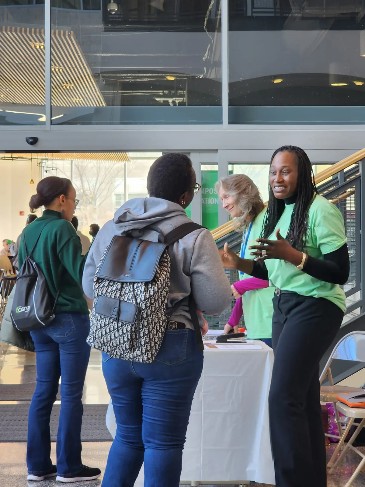R1YC representative discussing opportunities with job fair attendees