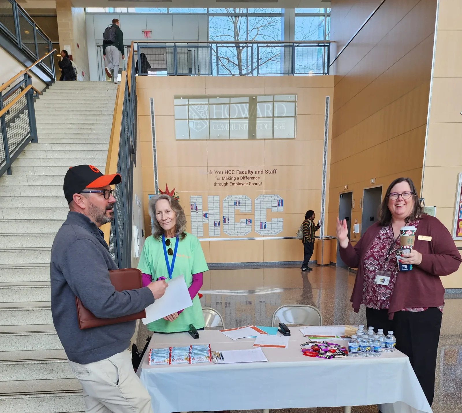 Community member visiting an R1YC program information table