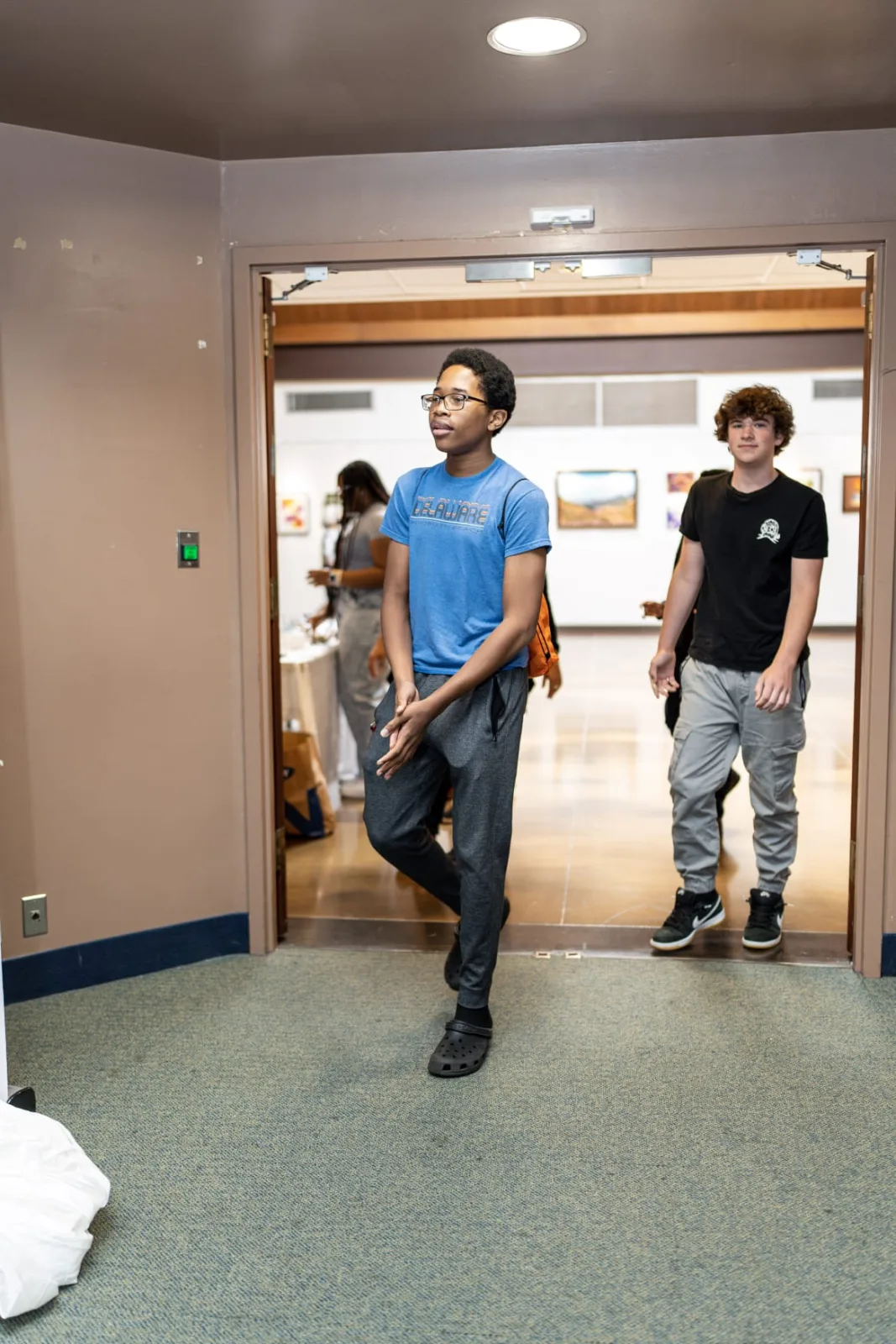 Students entering the room for a youth program session