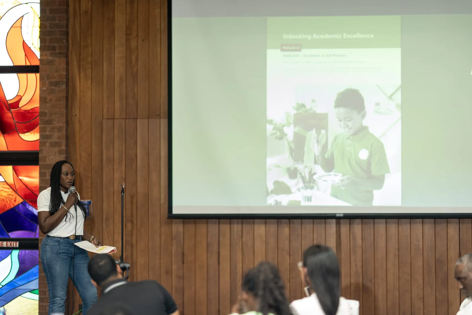 Young presenter leading a visual presentation for attendees