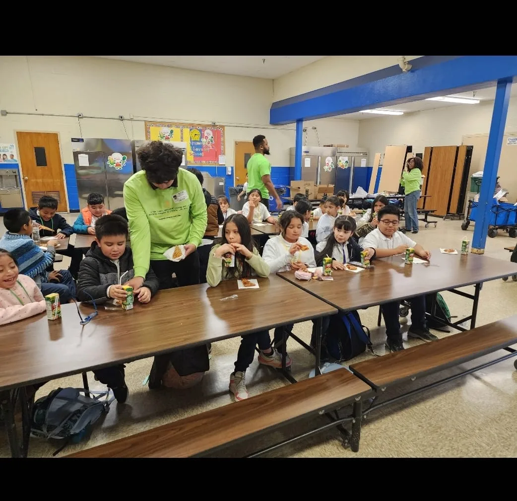 Facilitator guiding students through a classroom activity